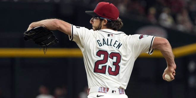 May 24, 2024; Phoenix, Arizona, USA; Arizona Diamondbacks pitcher Zac Gallen (23) throws against the Miami Marlins in the first inning at Chase Field. Mandatory Credit: Rick Scuteri-USA TODAY Sports