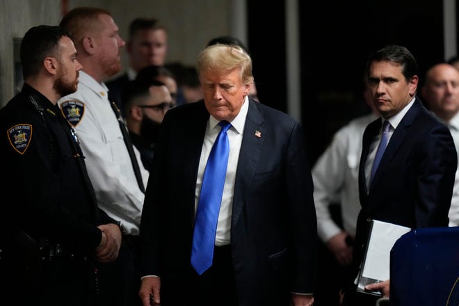 Former President Donald Trump walks to make comments to members of the media after being found guilty on 34 felony counts of falsifying business records in the first degree at Manhattan Criminal Court, Thursday, May 30, 2024, in New York. Donald Trump became the first former president to be convicted of felony crimes as a New York jury found him guilty of 34 felony counts of falsifying business records in a scheme to illegally influence the 2016 election through hush money payments to a porn actor who said the two had sex.