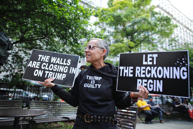 People react after former President and Republican presidential candidate Donald Trump was convicted in his criminal trial outside of Manhattan Criminal Court in New York City, on May 30, 2024.