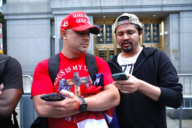 Trump supporters react as a verdict was reachead in the criminal trial of former President and Republican presidential candidate Donald Trump, in Collect Pond Park across the street from Manhattan Criminal Court on May 30, 2024 in New York City.