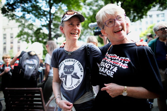 People react after former US President and Republican presidential candidate Donald Trump was found guilty in his criminal trial outside of Manhattan Criminal Court in New York City, on May 30, 2024.