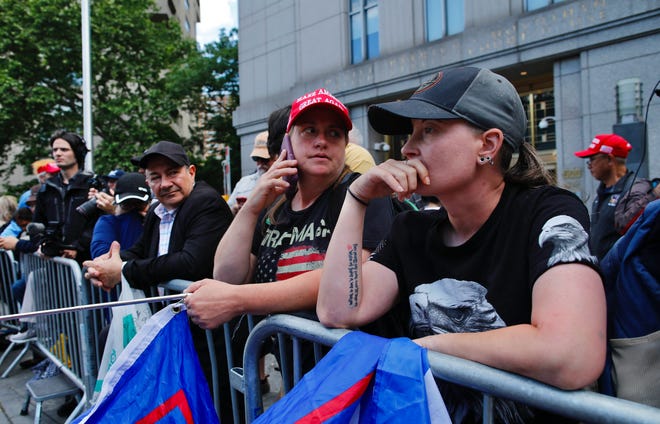 Trump supporters react as a verdict was reached in the criminal trial of former US President and Republican presidential candidate Donald Trump, in Collect Pond Park across the street from Manhattan Criminal Court on May 30, 2024 in New York City. Jurors return May 30, 2024 to a second day of deliberations in Donald Trump's criminal trial, leaving the Republican presidential candidate and the country waiting for a decision that could upend November's election.