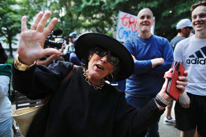 People react after former US President and Republican presidential candidate Donald Trump was convicted in his criminal trial outside of Manhattan Criminal Court in New York City, on May 30, 2024.