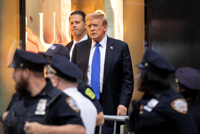 Former president Donald Trump's looks on after the announcement of the verdict of his criminal trial over charges that he falsified business records to conceal money paid to silence porn star Stormy Daniels in 2016, outside Trump Tower, in New York City on May 30, 2024