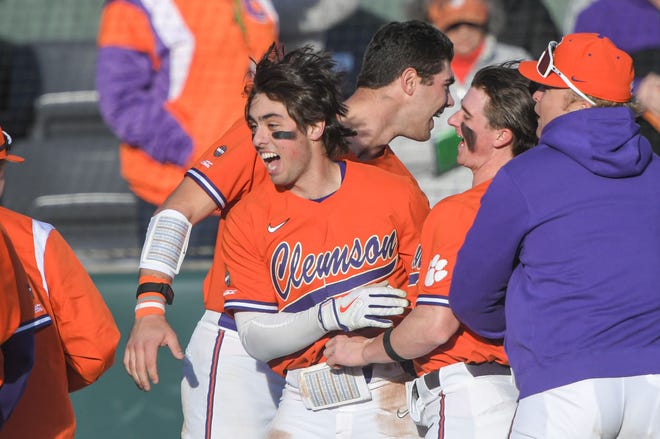 Clemson junior Blake Wright (8) celebrates his second home run of the game against Binghampton during the bottom of the third inning at Doug Kingsmore Stadium in Clemson Friday, February 17, 2023.