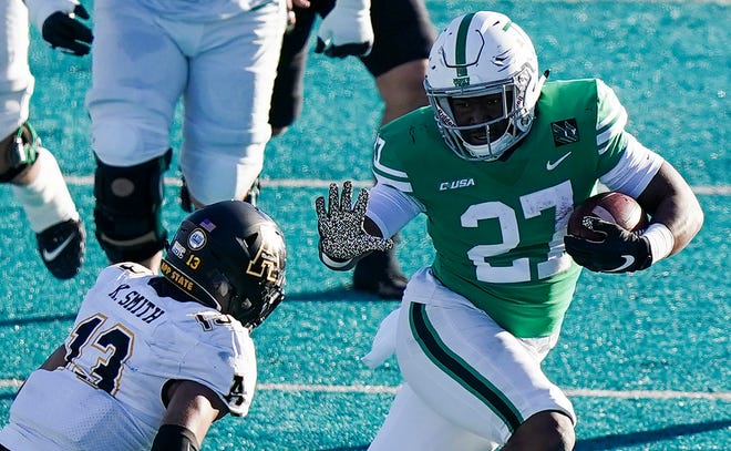 Myrtle Beach Bowl: North Texas running back Oscar Adaway III  (27) avoids Appalachian State Mountaineers defensive back Kaiden Smith in the second quarter at Brooks Stadium. Appalachian State prevailed, 56-28.