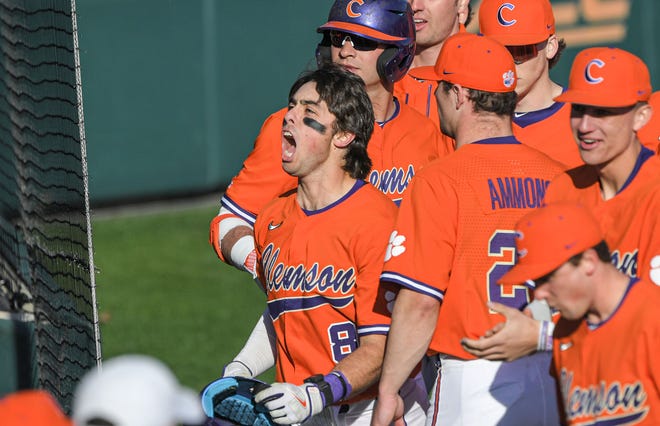 Clemson junior Blake Wright (8) celebrates his home run during the bottom of the first inning at Doug Kingsmore Stadium in Clemson Friday, February 17, 2023.